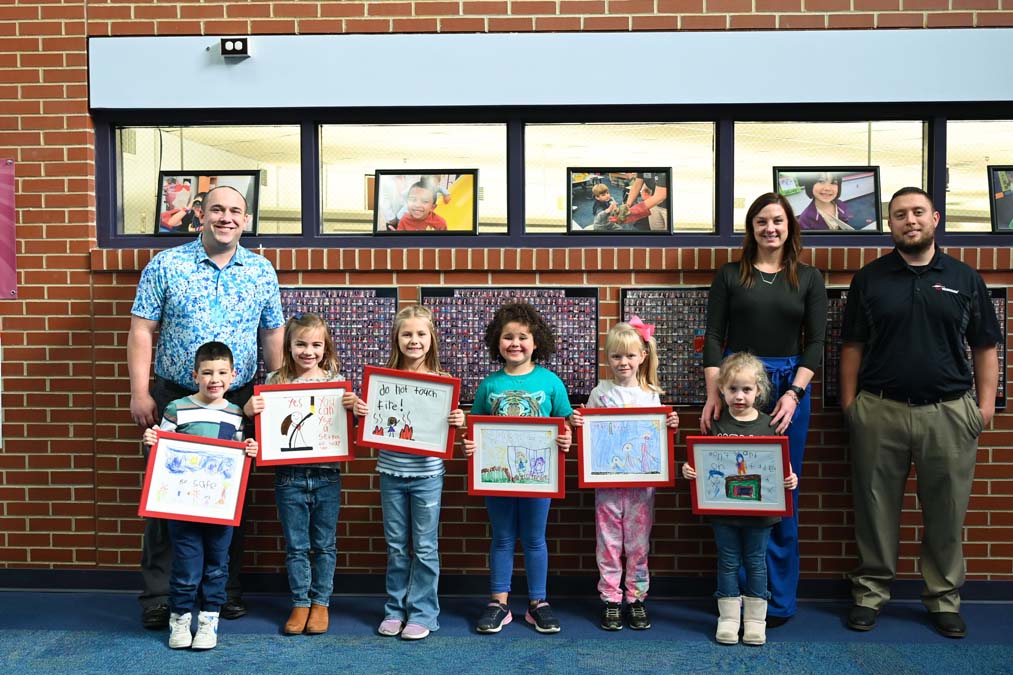 Alliance Early Learning School contest winners holding artwork