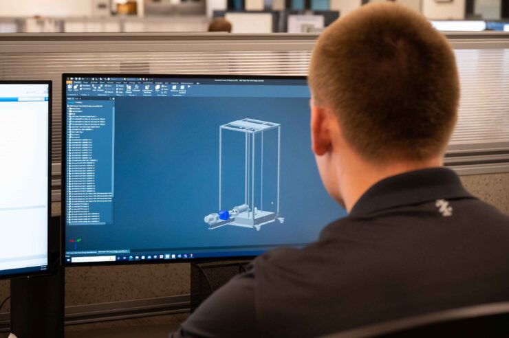 Figure 3 Intern reviewing 3D model for project.