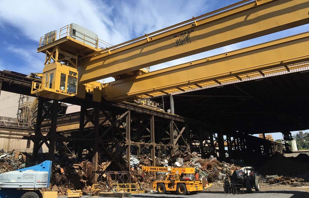 Overhead crane with a cab on the left side.