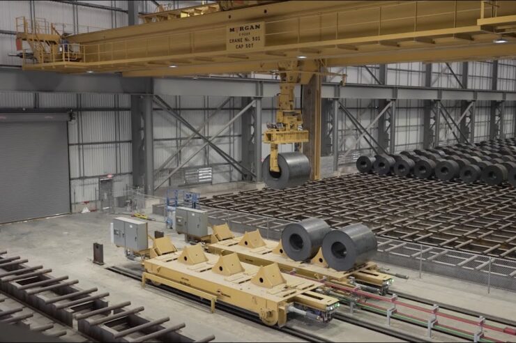 Autonomous Morgan crane lifting a steel coil