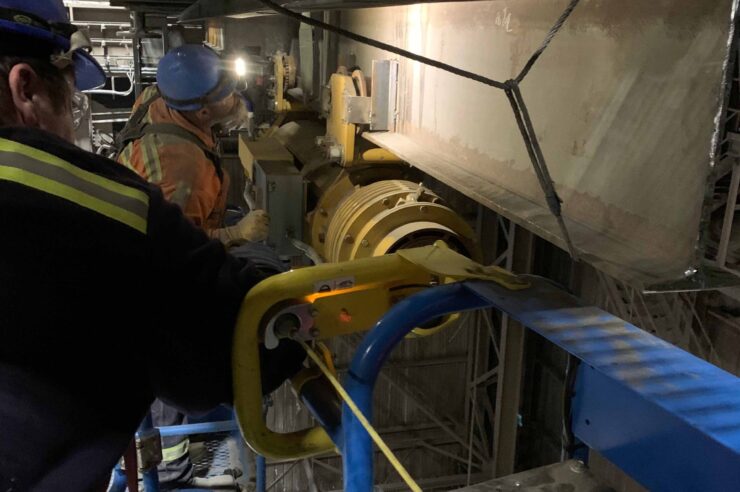 Morgan employees working on a monorail