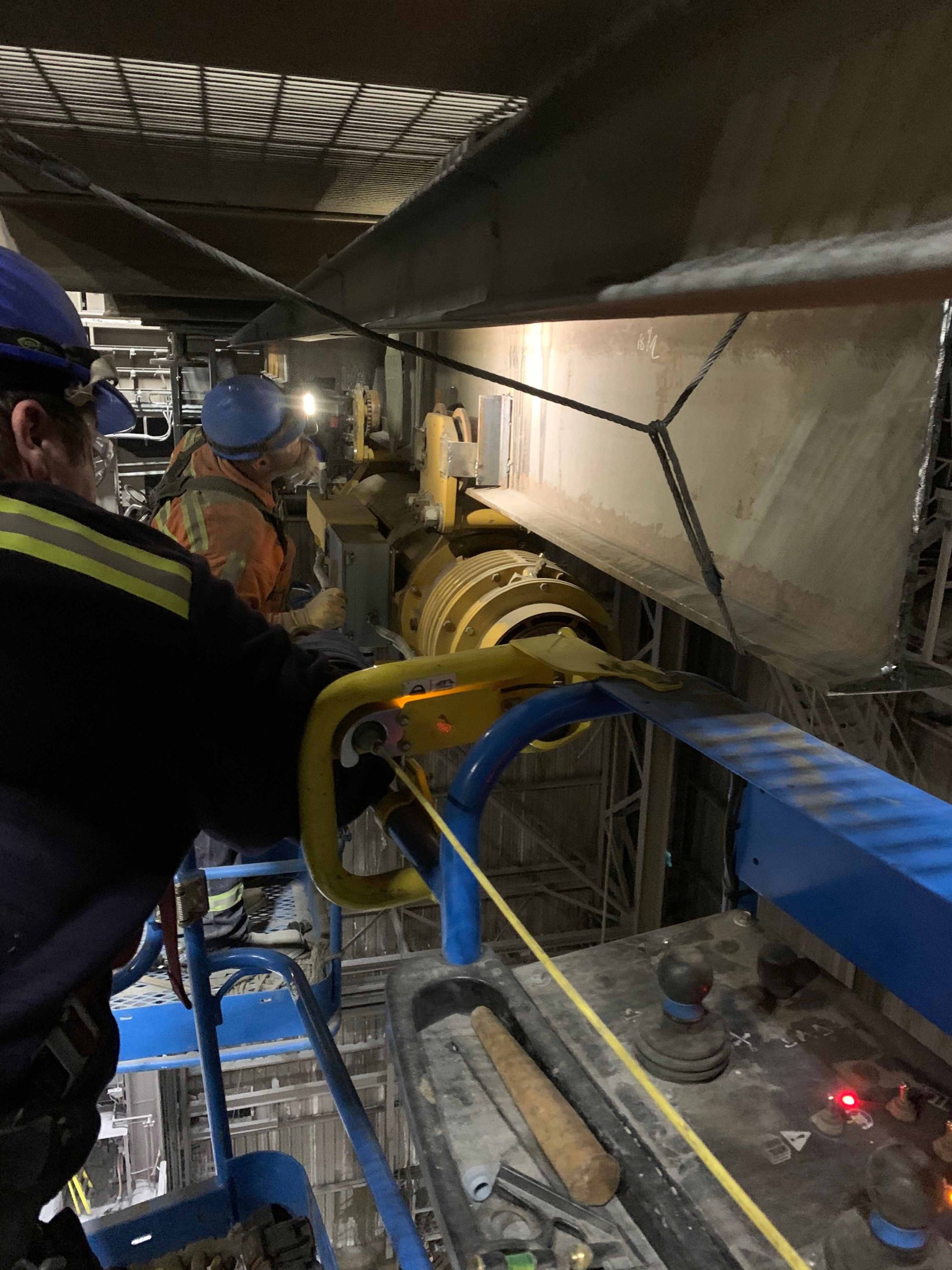 Morgan employees working on a monorail