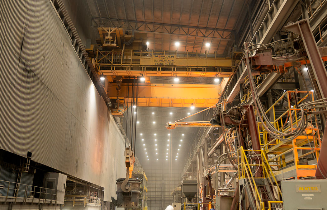 Overhead bridge crane carrying a ladle crane inside a factory