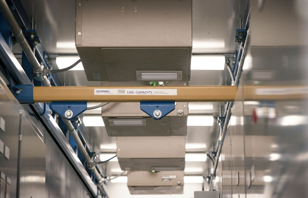 An overhead trolley rail system in a Morgan control house that's still in the process of being built