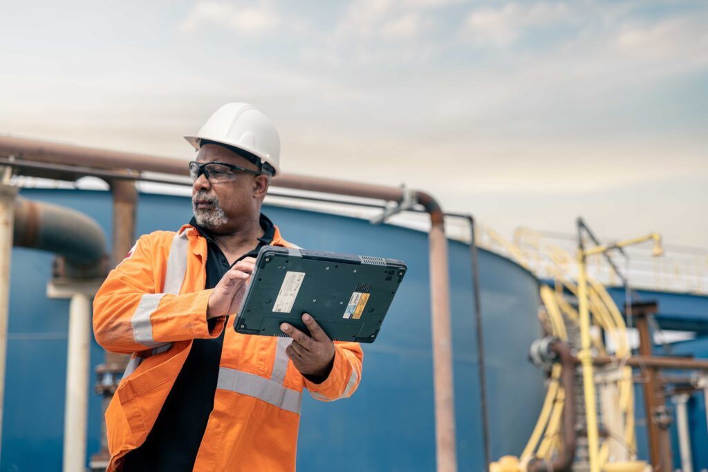 Personnel using water treatment management tablet