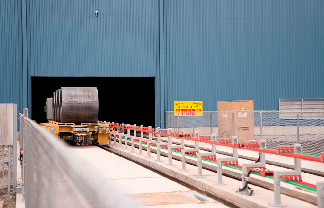 Automated transfer car carrying steel coils