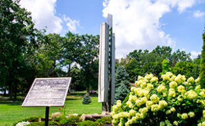 A plaque in Alliance, Ohio surrounded by the stark and summit county greenery and wildlife.