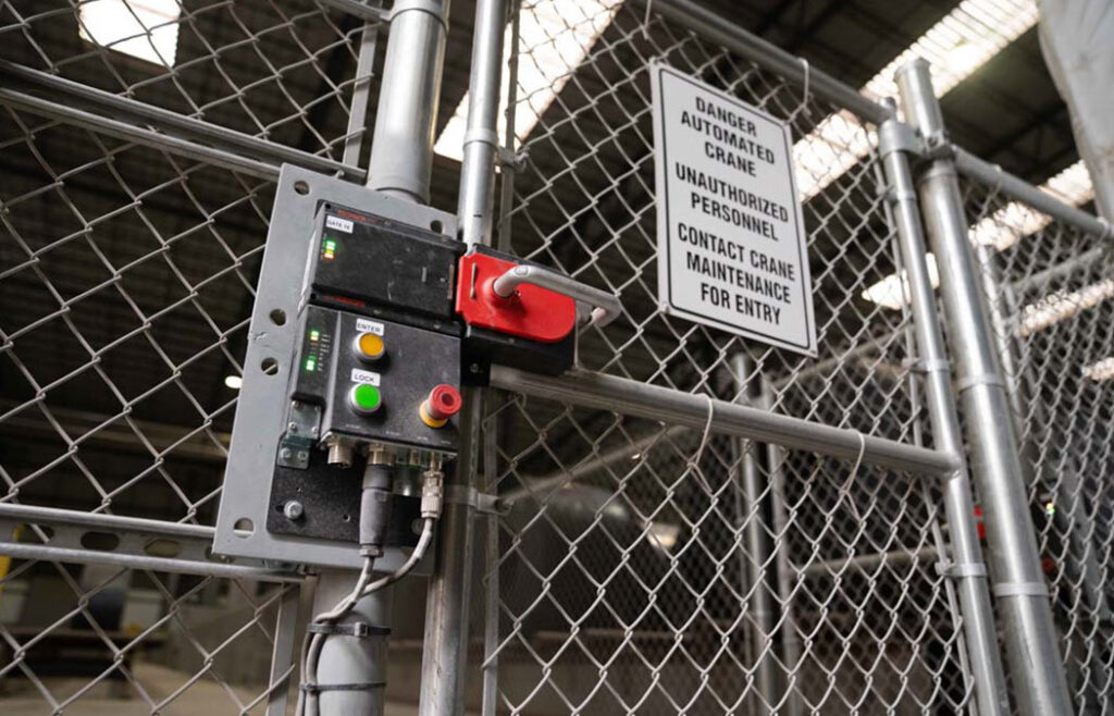 Gate to ground-based safety zone within coil yard.