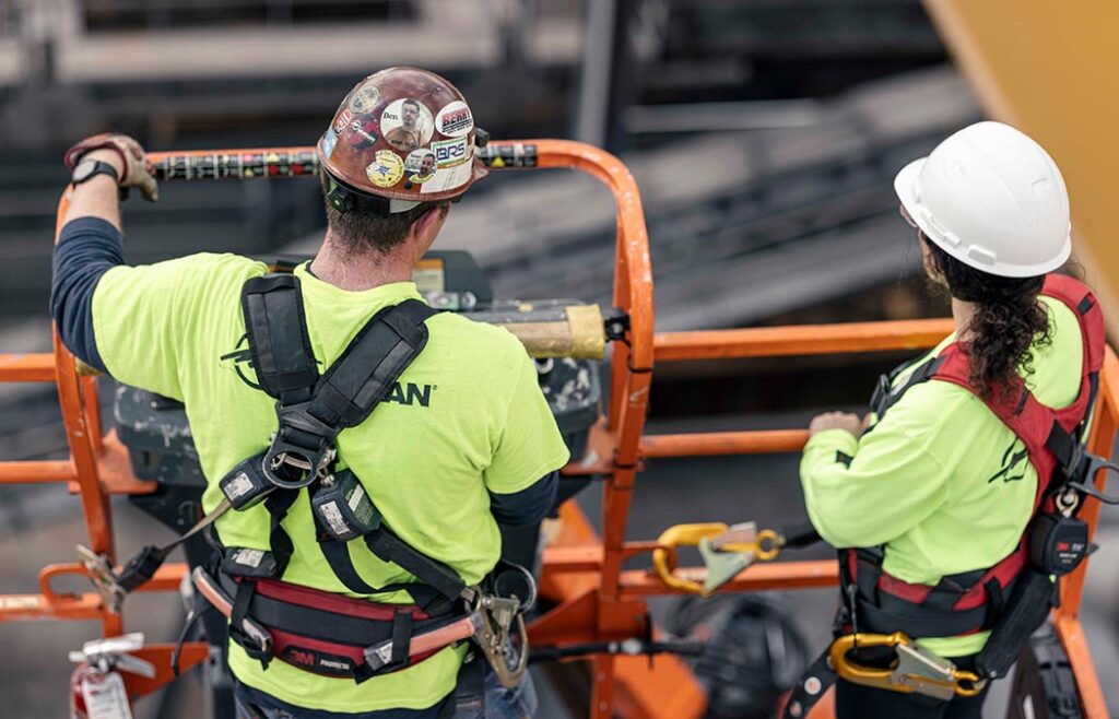 Crane Technicians utilizing mobile equipment to provide services on job site