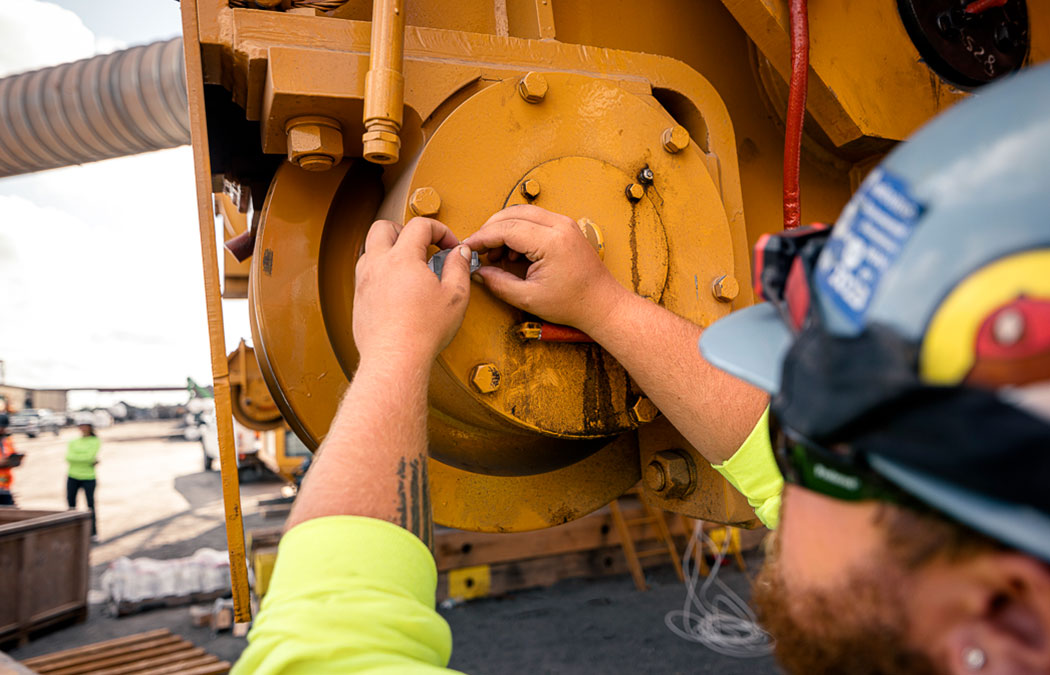 Site Services employee installing crane parts