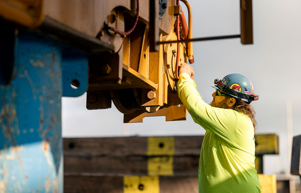 Man installing a Morgan crane on site