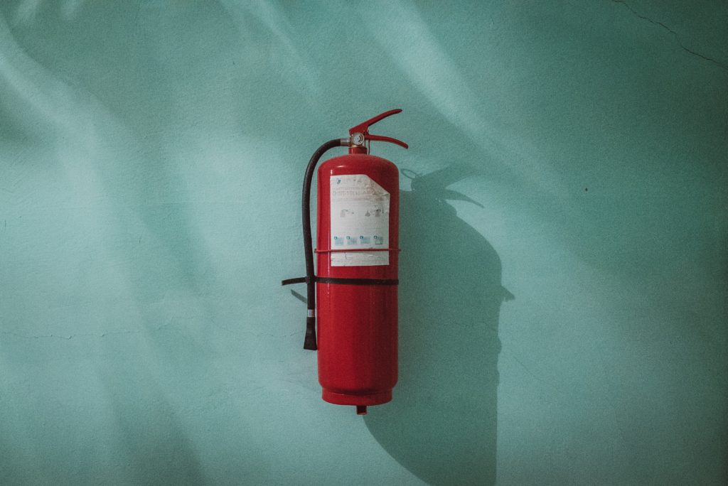 A fire extinguisher mounded on a wall
