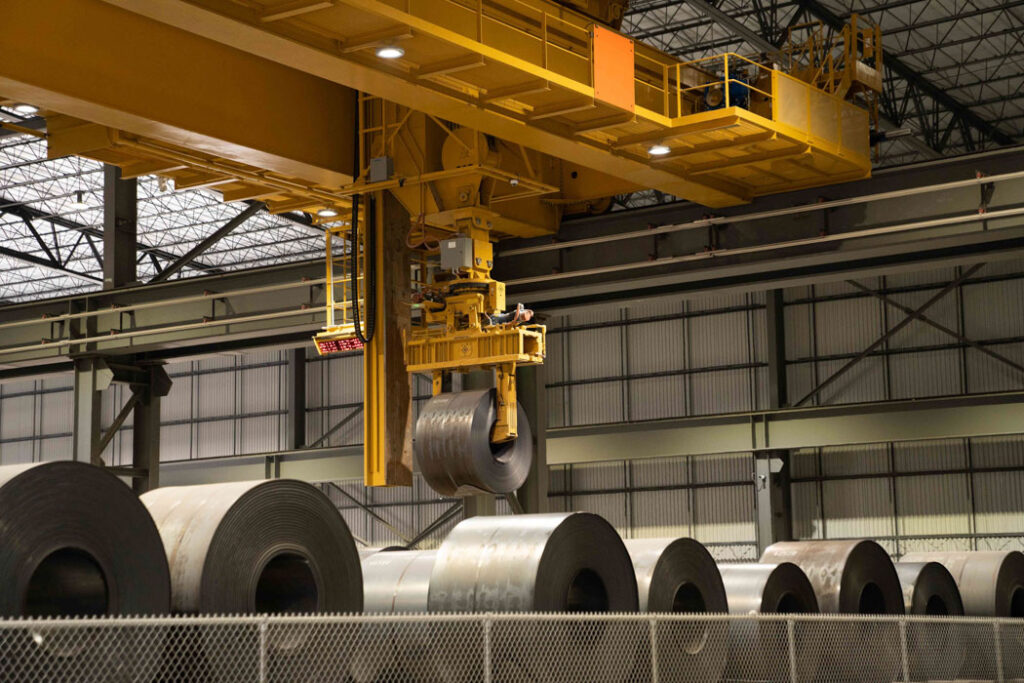 Morgan automated overhead crane lifting coil.